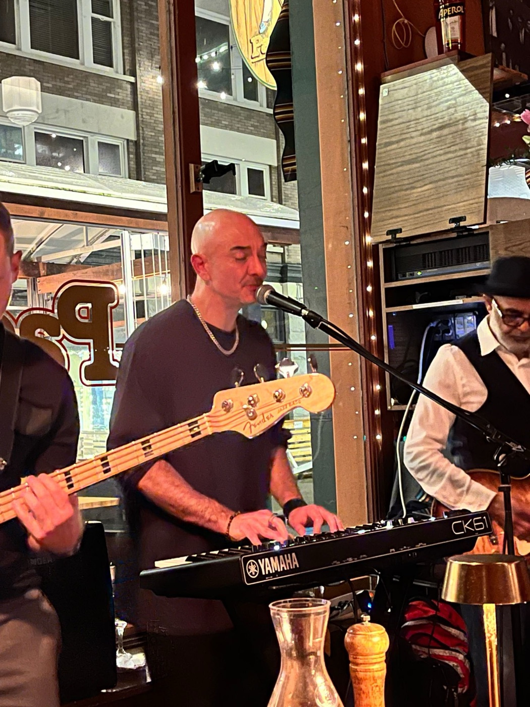 Julien Loreto singing and playing keys with a live band